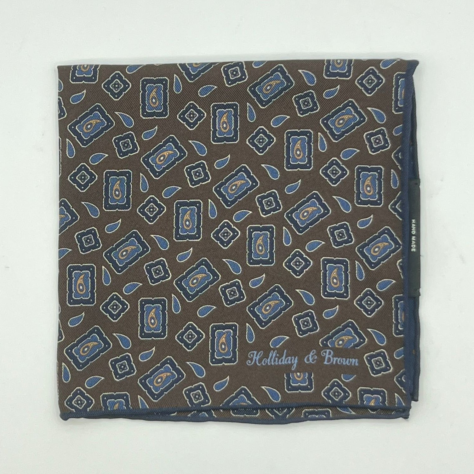 Holliday & Brown Hand-rolled   Holliday & Brown for Cruciani & Bella 100% Silk Brown, Blue and Light Blue Double Faces Patterned  Motif  Pocket Square Handmade in Italy 32 cm X 32 cm