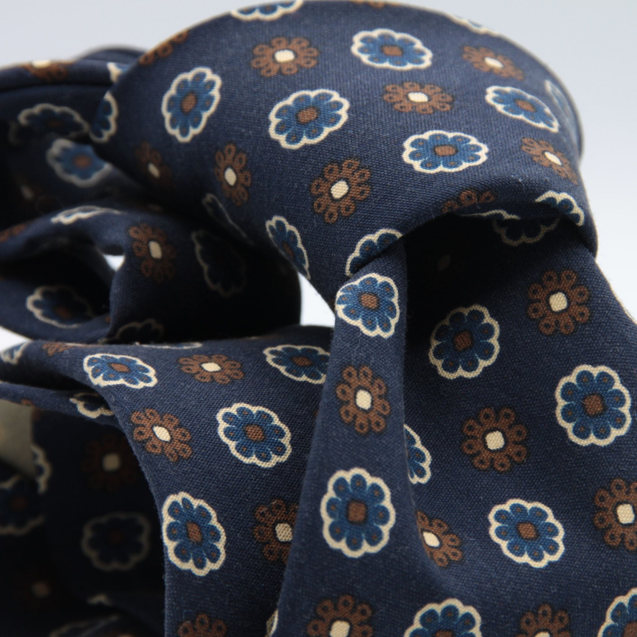 Cruciani &amp; Bella
100% printed Madder Silk
Unlined
Seven Folds
Navy Blue, Brown and Royal Blue Motif Tie
Handmade in Italy
8 cm x 150 cm
#9089