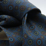 Cruciani &amp; Bella
100% printed Madder Silk
Unlined
Seven Folds
Denim Blue, Green, Brown and Light Blue Motif Tie
Handmade in Italy
8 cm x 150 cm
#9107