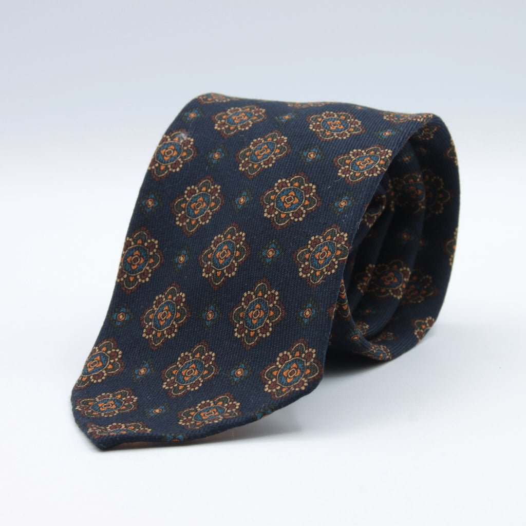 Cruciani &amp; Bella
Printed and Handmade in Italy
100% Wool
Unlined
Blue, Brown, Beige and Orange Motif Tie
8 cm x 150 cm
#9126