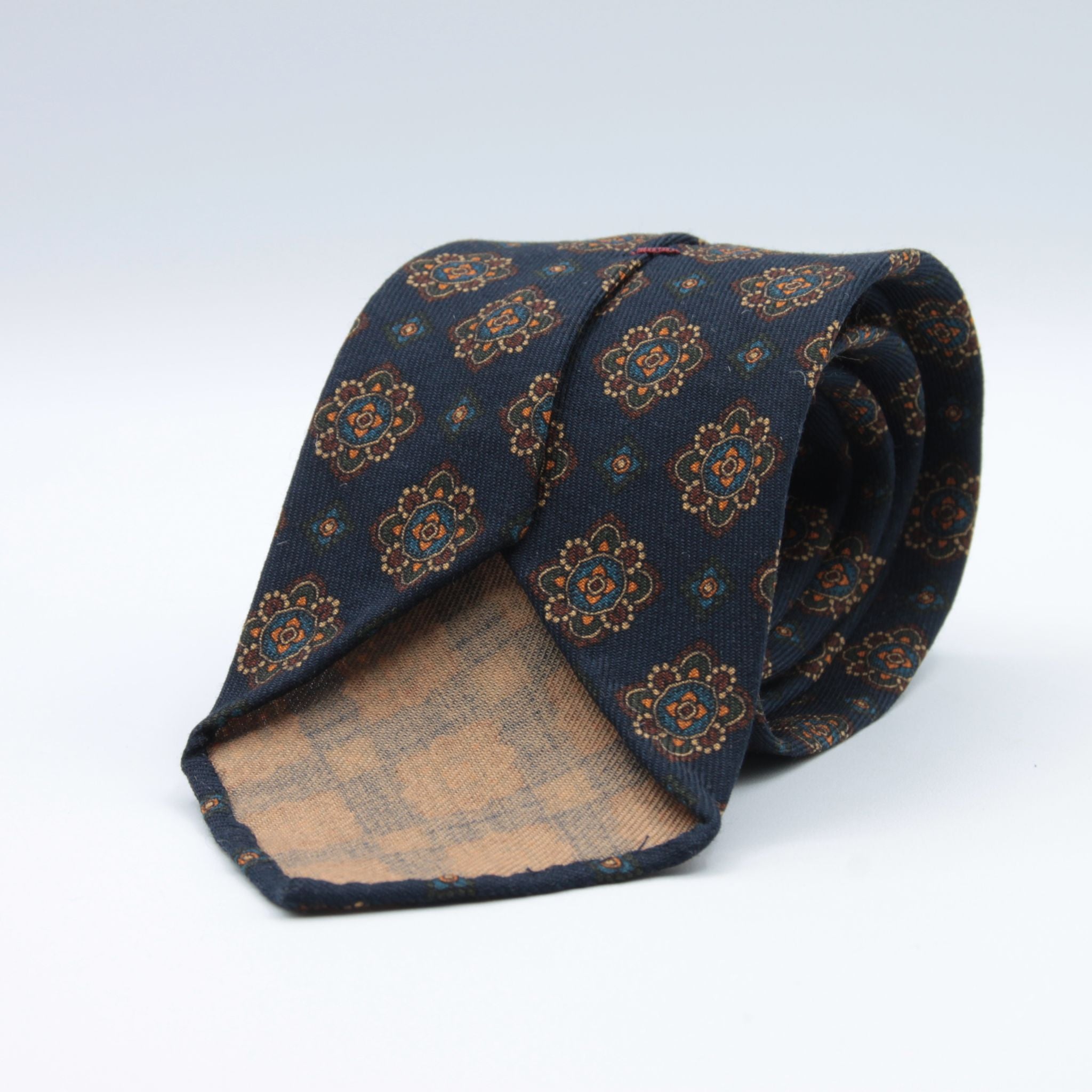 Cruciani &amp; Bella
Printed and Handmade in Italy
100% Wool
Unlined
Blue, Brown, Beige and Orange Motif Tie
8 cm x 150 cm
#9126