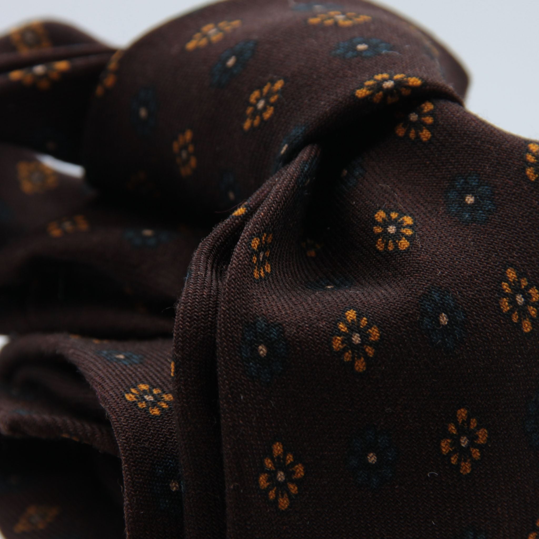 Cruciani &amp; Bella
Printed and Handmade in Italy
100% Wool
Unlined
Brown, Orange and Teal (Ottanio) Motif Tie
8 cm x 150 cm
#9133