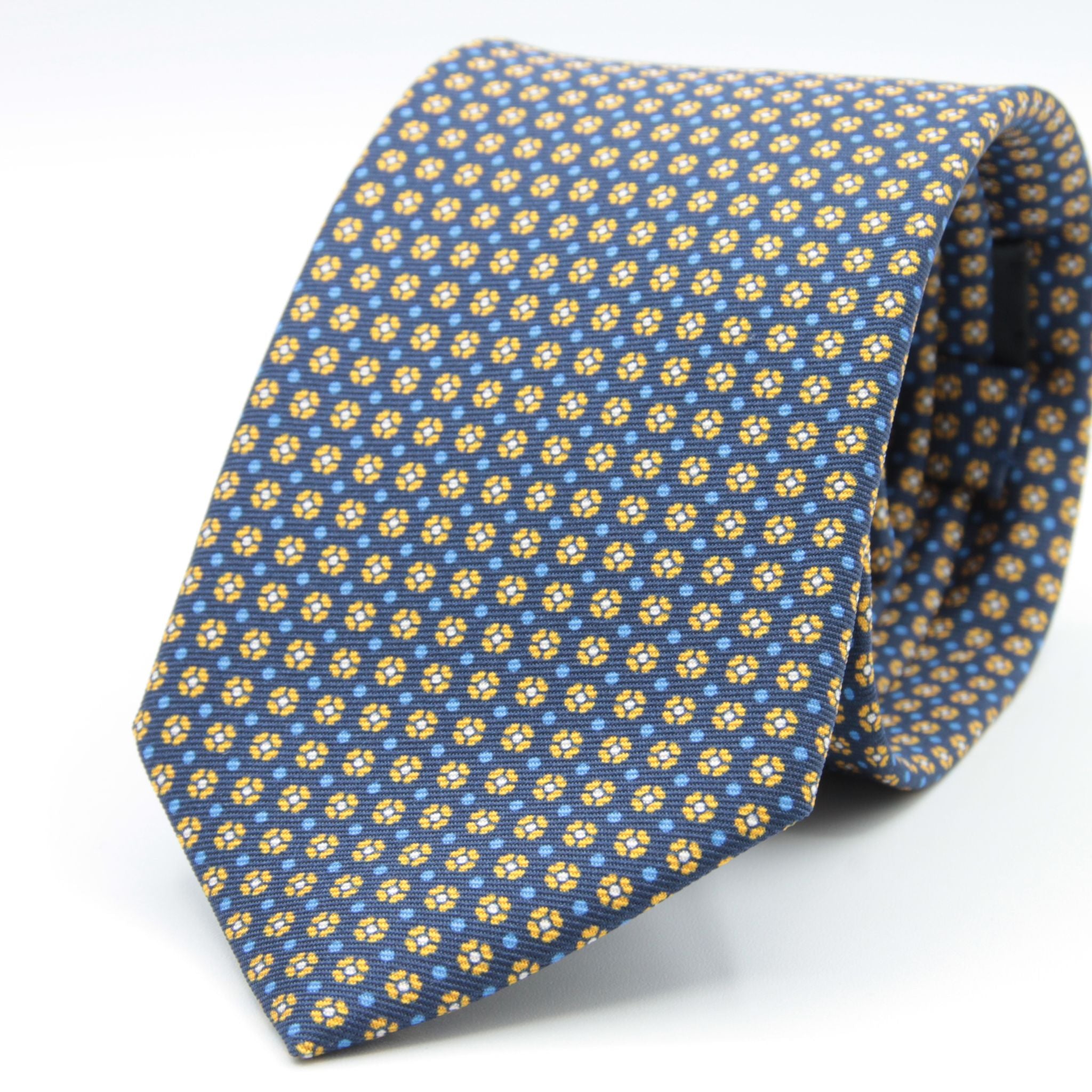 Holliday &amp; Brown for Cruciani &amp; Bella
100% printed Silk
Self Tipped
Navy blue, mustard, light blue and white motif Tie
Handmade in Italy
8 cm x 150 cm
#8963