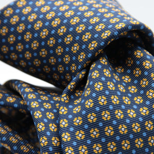 Holliday &amp; Brown for Cruciani &amp; Bella
100% printed Silk
Self Tipped
Navy blue, mustard, light blue and white motif Tie
Handmade in Italy
8 cm x 150 cm
#8963