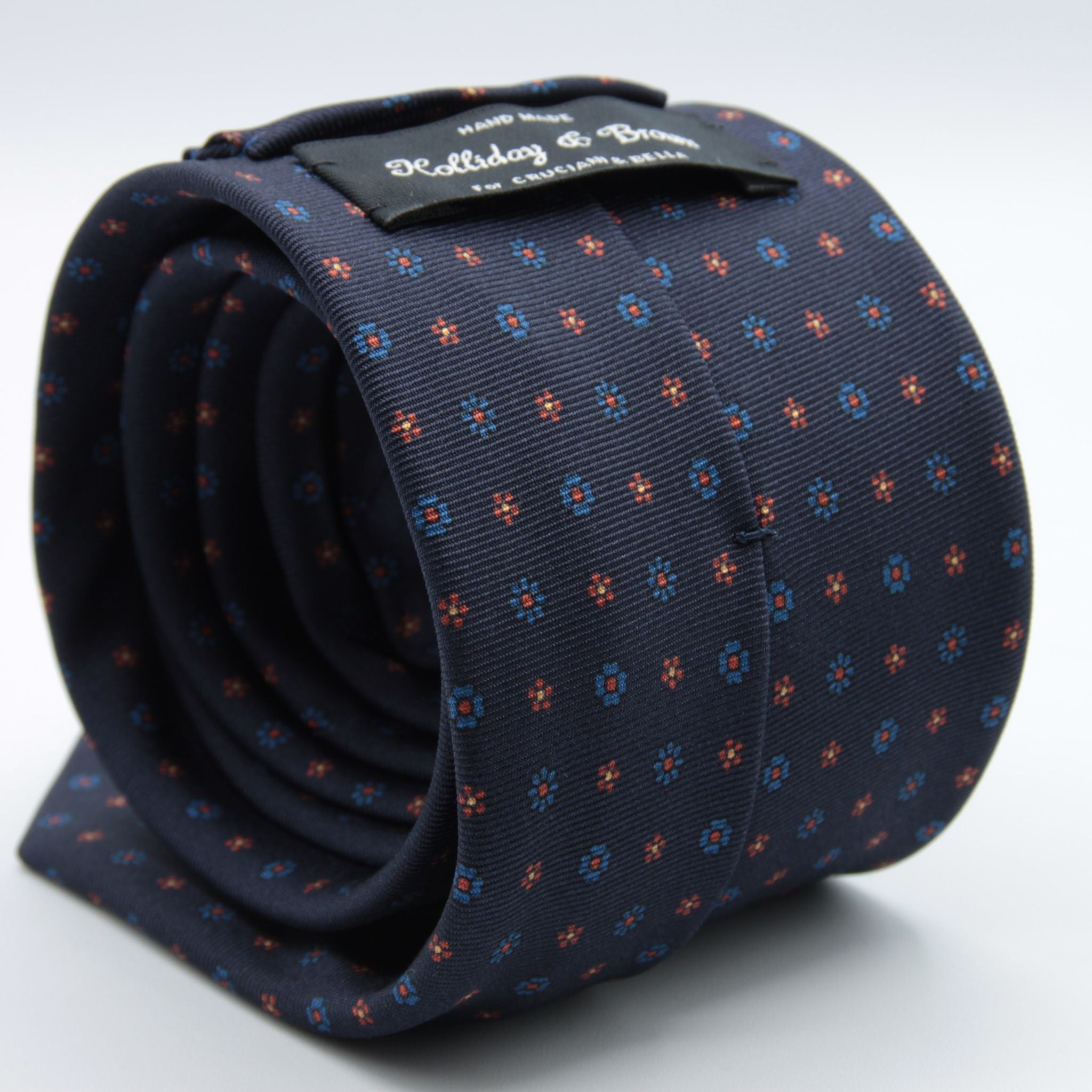 Holliday &amp; Brown for Cruciani &amp; Bella
100% printed Silk
Self Tipped
Navy Blue, Rust, Light Blue and Yellow motif Tie
Handmade in Italy
8 cm x 150 cm
#8941