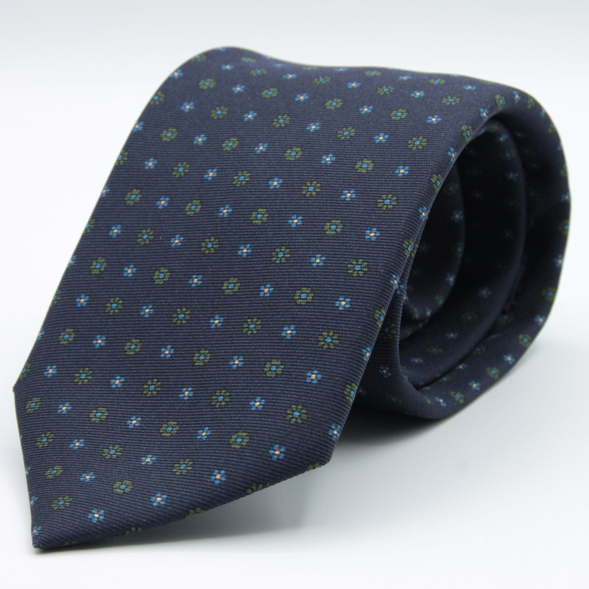 Holliday &amp; Brown for Cruciani &amp; Bella
100% printed Silk
Self Tipped
Navy Blue, Green, Light Blue and Yellow motif Tie
Handmade in Italy
8 cm x 150 cm
#8942