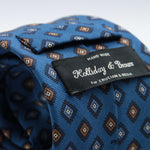 Holliday &amp; Brown for Cruciani &amp; Bella
100% printed Madder Silk
Self Tipped
Denim Blue, Navy Blue and Mustard medallions motif Tie
Handmade in Italy
8 cm x 150 cm
#8956