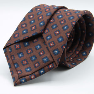 Holliday &amp; Brown for Cruciani &amp; Bella
100% printed Madder Silk
Self Tipped
Brown, Navy Blue and Rust medallions motif Tie
Handmade in Italy
8 cm x 150 cm
#8957