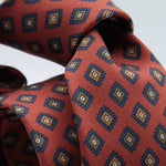 Holliday &amp; Brown for Cruciani &amp; Bella
100% printed Madder Silk
Self Tipped
Red Orange, Blue, Olive green and Mustard medallions motif Tie
Handmade in Italy
8 cm x 150 cm
#8958