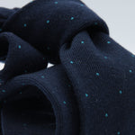 Holliday &amp; Brown for Cruciani &amp; Bella
85% Wool - 15% Silk
Tipped

Navy Blue and Torquoise micro-dots motif tie
Handmade in Italy

8 cm x 150 cm
#8982