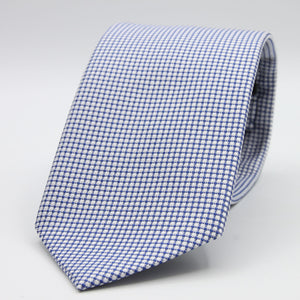 Holliday &amp; Brown for Cruciani &amp; Bella
100%&nbsp;Woven Jacquard Silk
Tipped
Royal Blue and White color motif tie
Handmade in Italy

8 cm x 150 cm
#9347