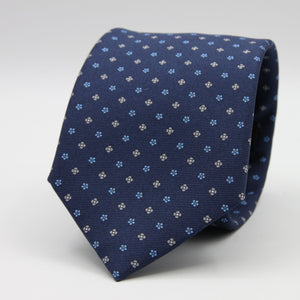 Holliday &amp; Brown for Cruciani &amp; Bella
100% Printed Silk
Self Tipped
Navy Blue, Grey and Light Blue motif Tie
Handmade in Italy
8 cm x 150 cm
#9363