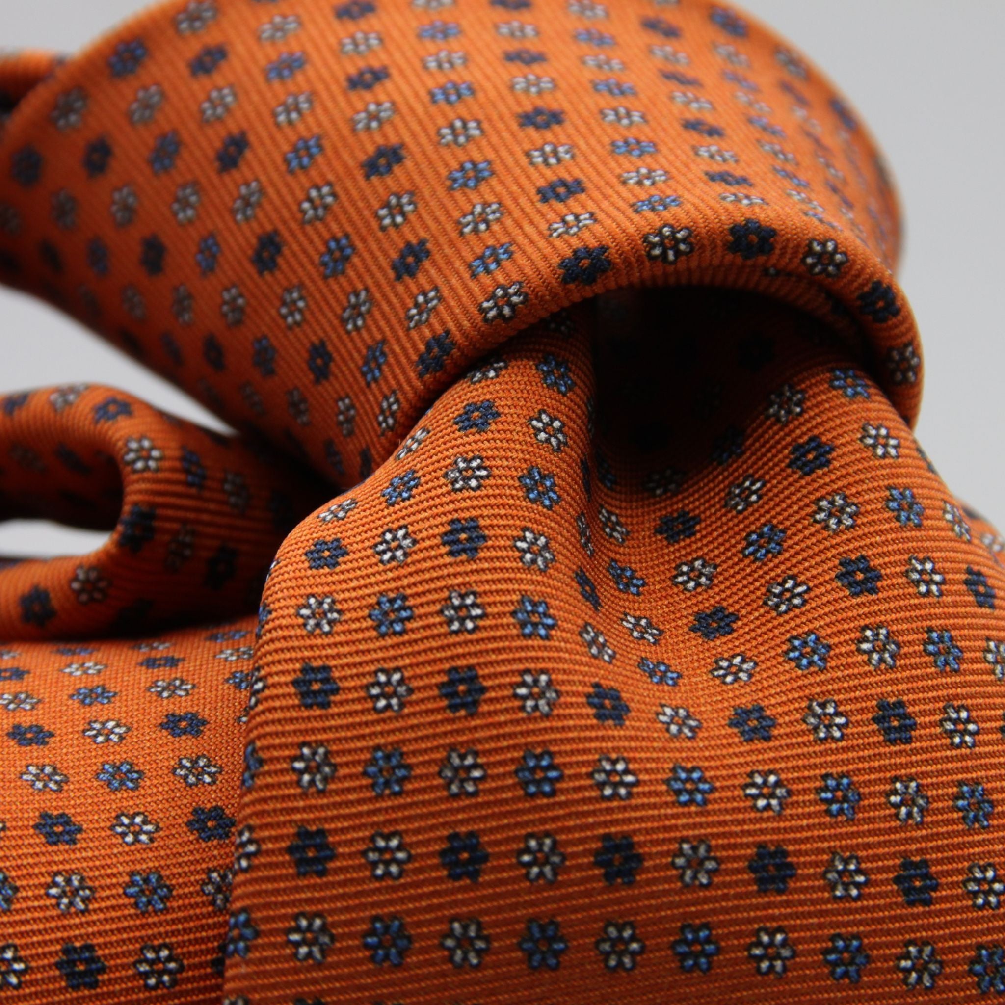 Holliday &amp; Brown for Cruciani &amp; Bella
100% Printed Silk
Self Tipped
Light Orange, Navy Blue, Light Blue and White motif Tie
Handmade in Italy
8 cm x 150 cm
#9354