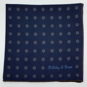 Holliday &amp; Brown for Cruciani &amp; Bella
Hand-rolled&nbsp;&nbsp;

100% Silk
Dark Blue, Brown and Light Blue
Double Faces
Motif&nbsp; Pocket Square
Handmade in Italy

32 cm X 32 cm