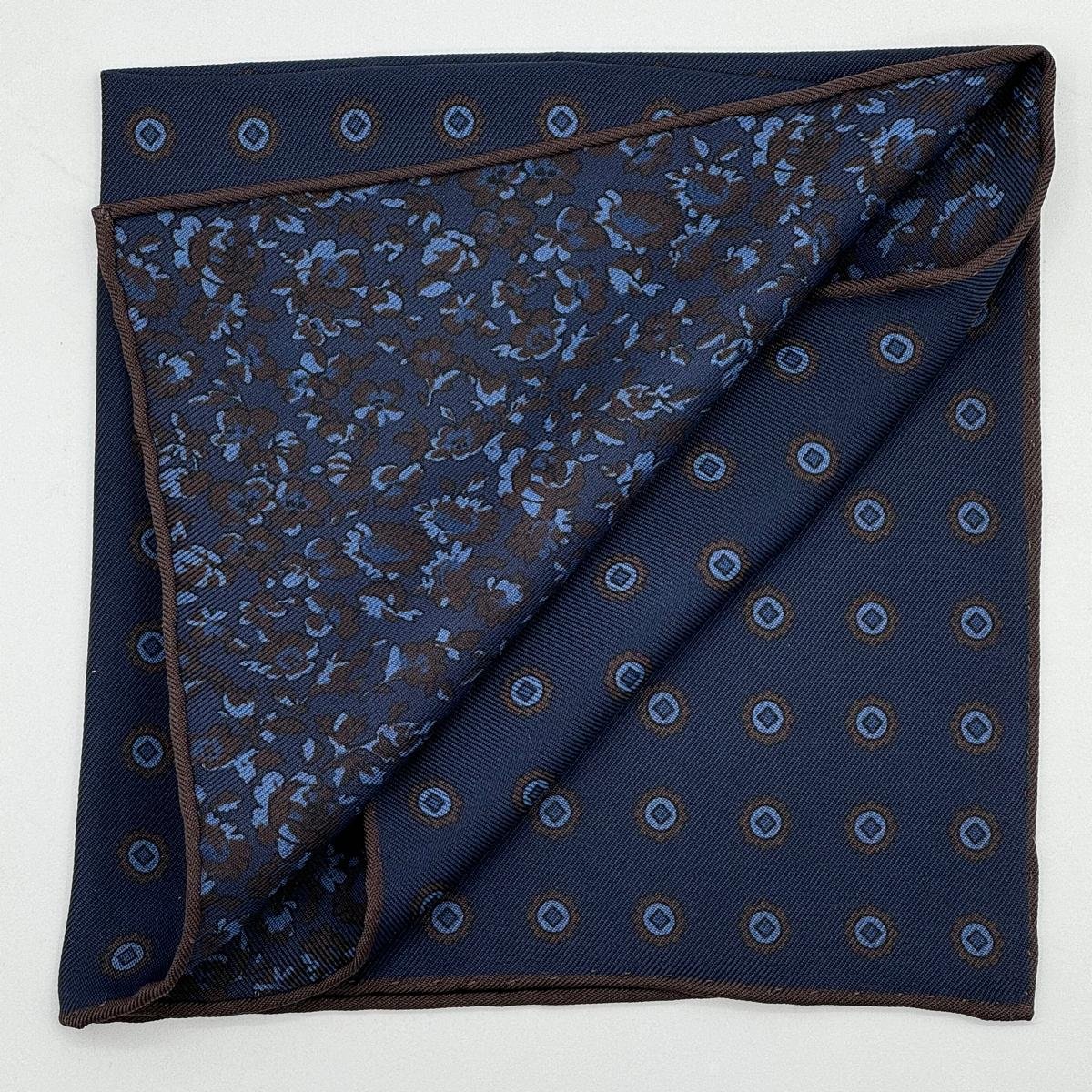 Holliday &amp; Brown for Cruciani &amp; Bella
Hand-rolled&nbsp;&nbsp;

100% Silk
Dark Blue, Brown and Light Blue
Double Faces
Motif&nbsp; Pocket Square
Handmade in Italy

32 cm X 32 cm