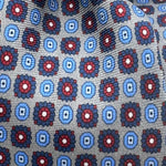 Cruciani &amp; Bella
100% Printed Silk&nbsp;
Tipped
Grey, Light Blue, Blue and Red Motif Tie
Handmade in Italy
8,5 cm x 148 cm
New Old Stock