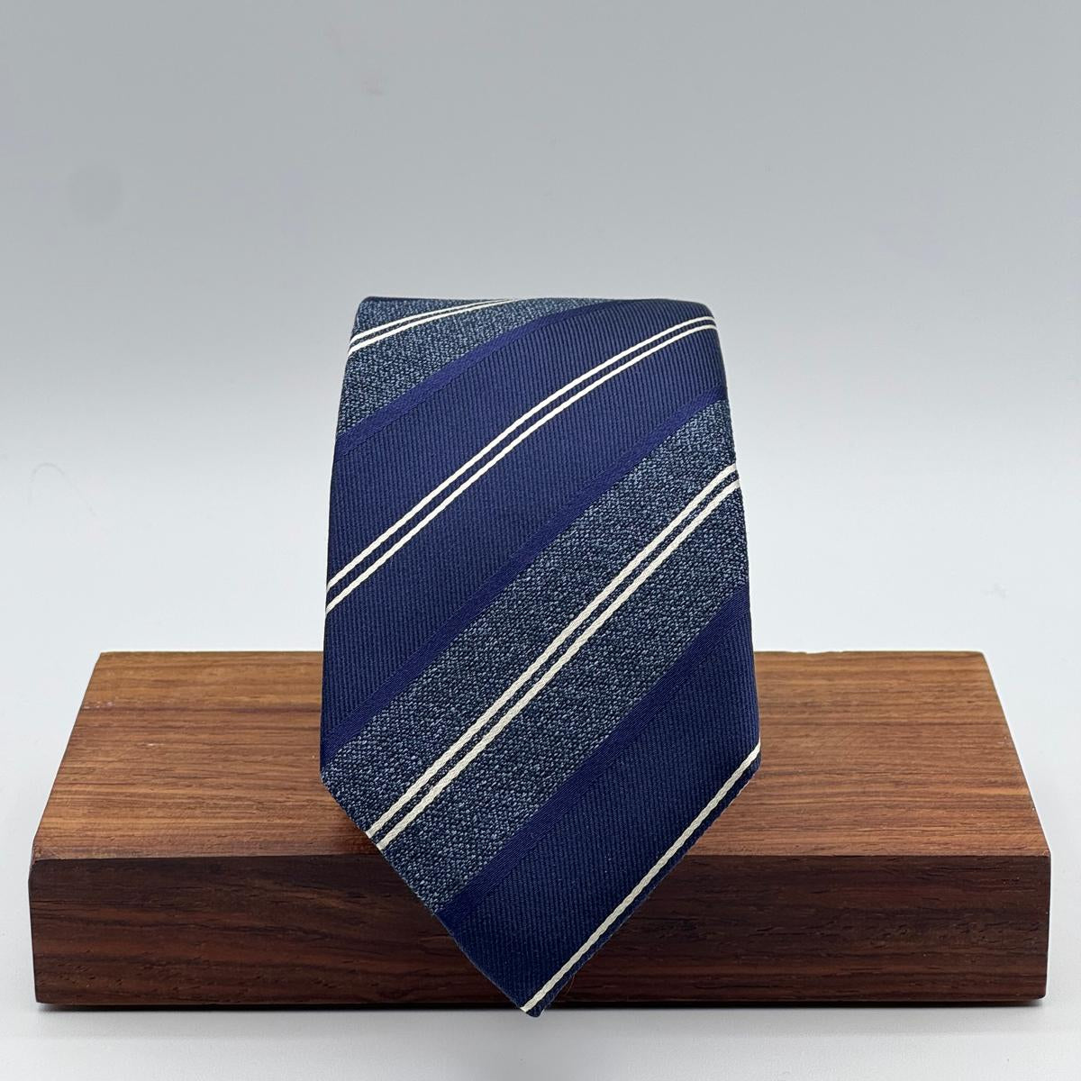 Cruciani &amp; Bella
100% Silk&nbsp;
Woven Jaquard
Tipped Tie
Blue, Light Blue and White Stripes
Handmade in Italy
7 cm x 148 cm
New Old Stock