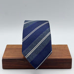 Cruciani &amp; Bella
100% Silk&nbsp;
Woven Jaquard
Tipped Tie
Blue, Light Blue and White Stripes
Handmade in Italy
7 cm x 148 cm
New Old Stock