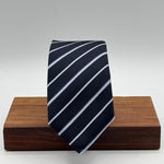 Cruciani &amp; Bella
100% Silk&nbsp;
Woven Jacquard&nbsp;
Self Tipped
Dark Bleu, Grey and Light Bleu Stripes Tie
Handmade in Italy
New Old Stock
7 cm x 150 cm