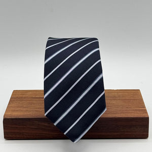 Cruciani &amp; Bella
100% Silk&nbsp;
Woven Jacquard&nbsp;
Self Tipped
Dark Bleu, Grey and Light Bleu Stripes Tie
Handmade in Italy
New Old Stock
7 cm x 150 cm