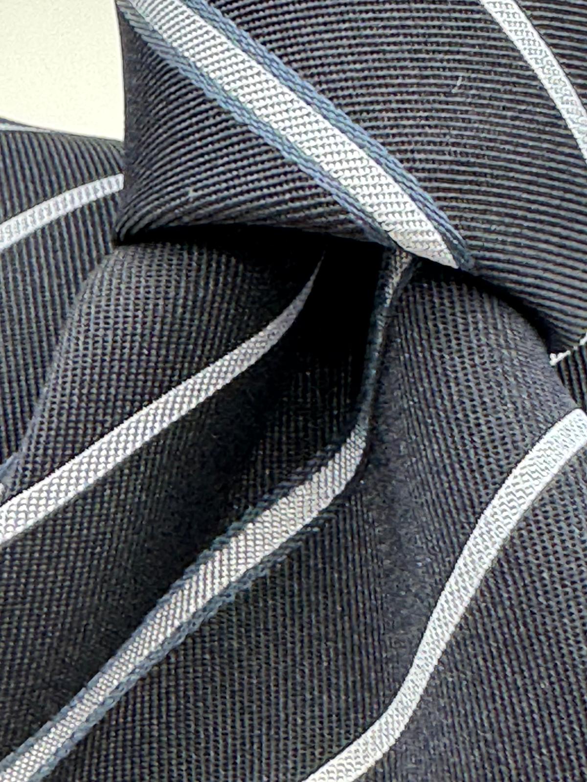 Cruciani &amp; Bella
100% Silk&nbsp;
Woven Jacquard&nbsp;
Self Tipped
Dark Bleu, Grey and Light Bleu Stripes Tie
Handmade in Italy
New Old Stock
7 cm x 150 cm