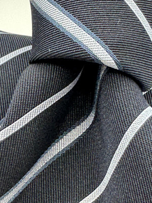 Cruciani &amp; Bella
100% Silk&nbsp;
Woven Jacquard&nbsp;
Self Tipped
Dark Bleu, Grey and Light Bleu Stripes Tie
Handmade in Italy
New Old Stock
7 cm x 150 cm