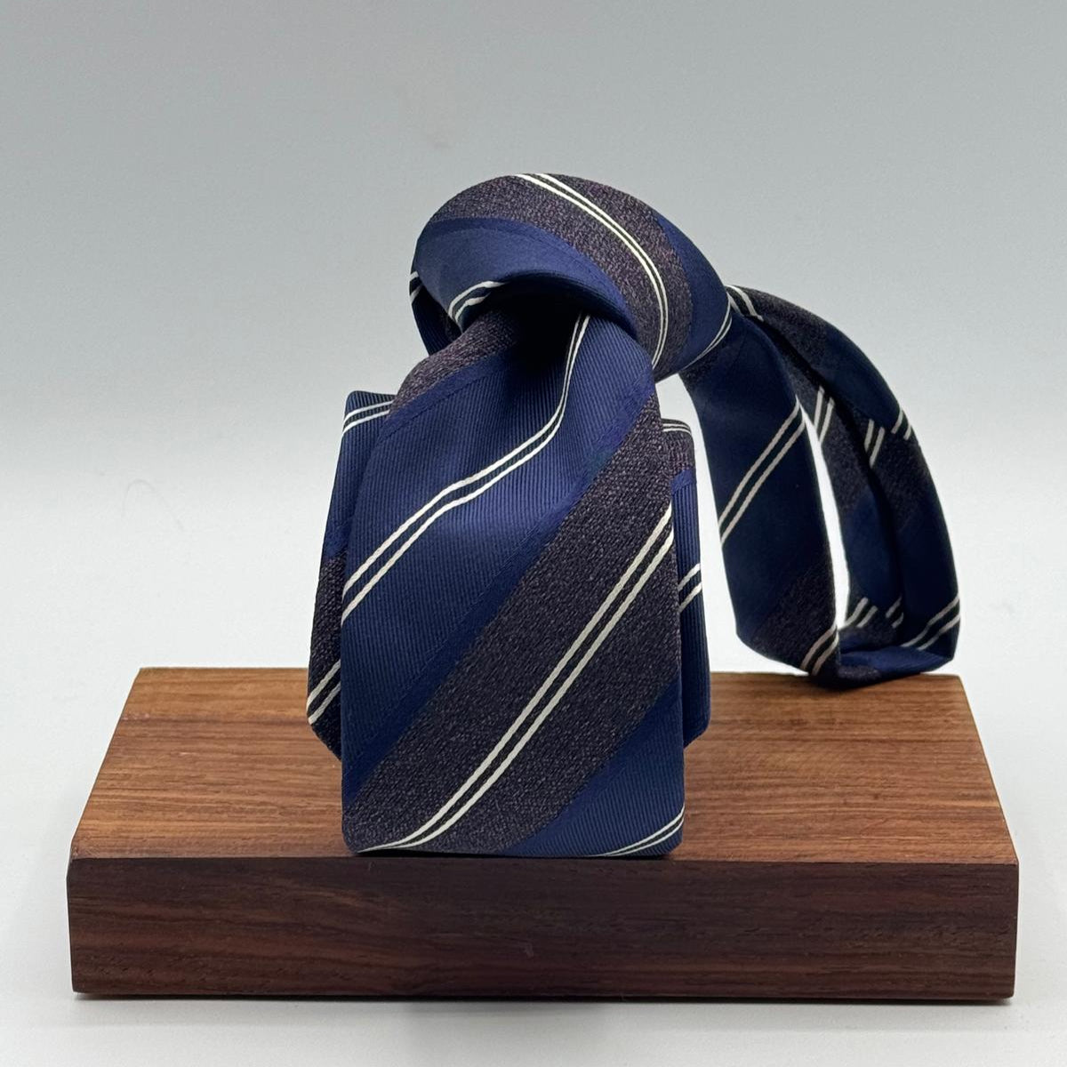 Cruciani &amp; Bella
100% Silk&nbsp;
Woven Jaquard
Tipped Tie
Blue, Brown and White Stripes
Handmade in Italy
7 cm x 148 cm
New Old Stock