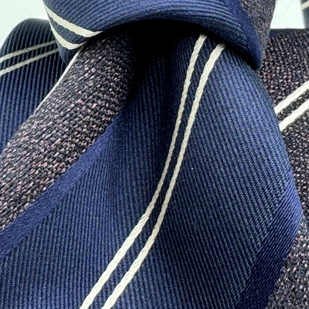 Cruciani &amp; Bella
100% Silk&nbsp;
Woven Jaquard
Tipped Tie
Blue, Brown and White Stripes
Handmade in Italy
7 cm x 148 cm
New Old Stock