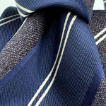 Cruciani &amp; Bella
100% Silk&nbsp;
Woven Jaquard
Tipped Tie
Blue, Brown and White Stripes
Handmade in Italy
7 cm x 148 cm
New Old Stock