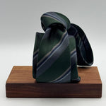 Cruciani &amp; Bella
100% Woven Silk&nbsp;

Self Tipped&nbsp;
Green, Grey and Light Blue stripes

Handmade in Italy
8 cm x 148 cm
New Old Stock
