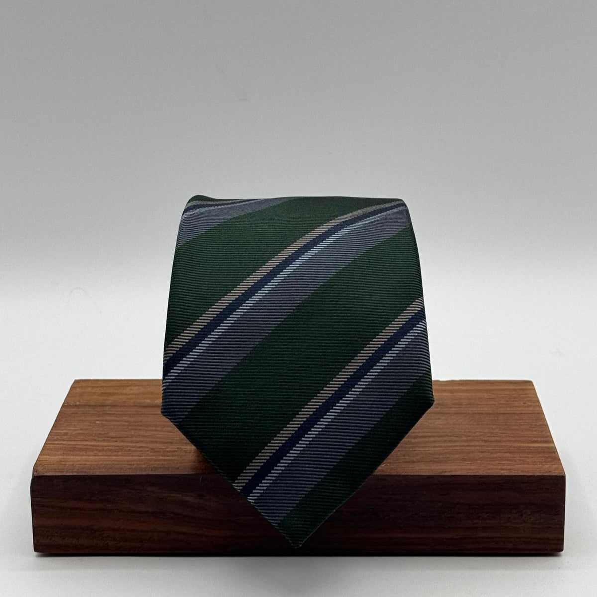 Cruciani &amp; Bella
100% Woven Silk&nbsp;

Self Tipped&nbsp;
Green, Grey and Light Blue stripes

Handmade in Italy
8 cm x 148 cm
New Old Stock