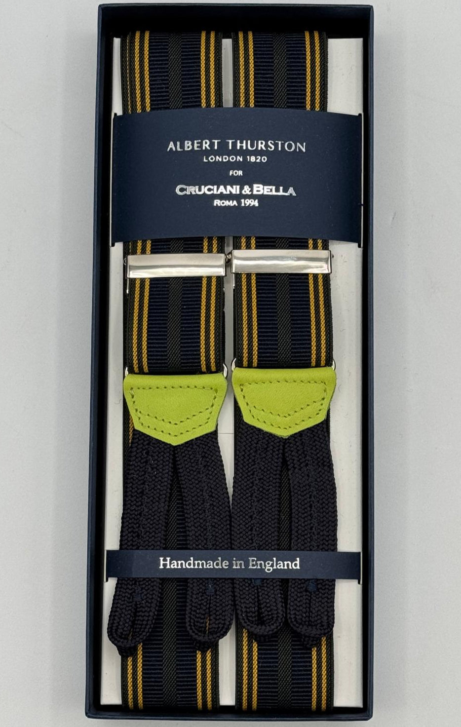 Albert Thurston for Cruciani &amp; Bella
Made in England
Adjustable Sizing
35 mm elastic&nbsp; braces
Blue, Yellow and Dark Green Stripes braces
Braid ends
Y-Shaped
Nickel Fittings
Size Multifit Adjustable&nbsp;Length:&nbsp;115cm (= 45 inch) Maximum