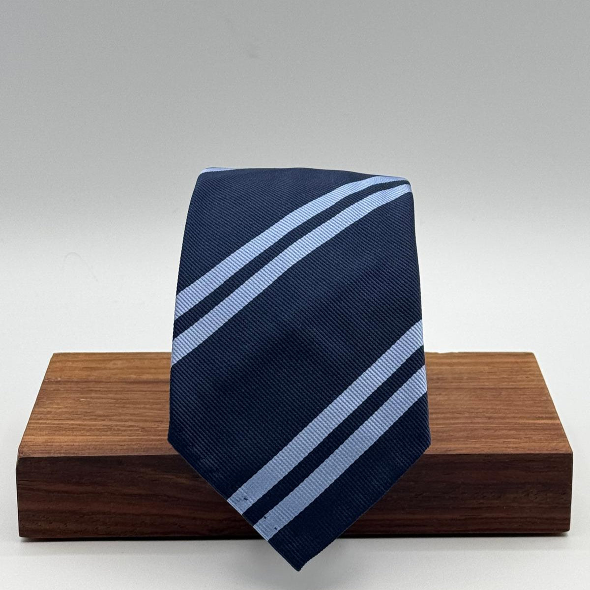 Cruciani &amp; Bella
100% Silk&nbsp;
Unlined
Brown Tie
Blue and Light Blue Stripes Tie
Handmade in Italy
7,5 cm x 148 cm
New Old Stock