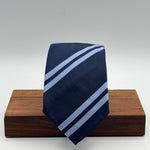 Cruciani &amp; Bella
100% Silk&nbsp;
Unlined
Brown Tie
Blue and Light Blue Stripes Tie
Handmade in Italy
7,5 cm x 148 cm
New Old Stock