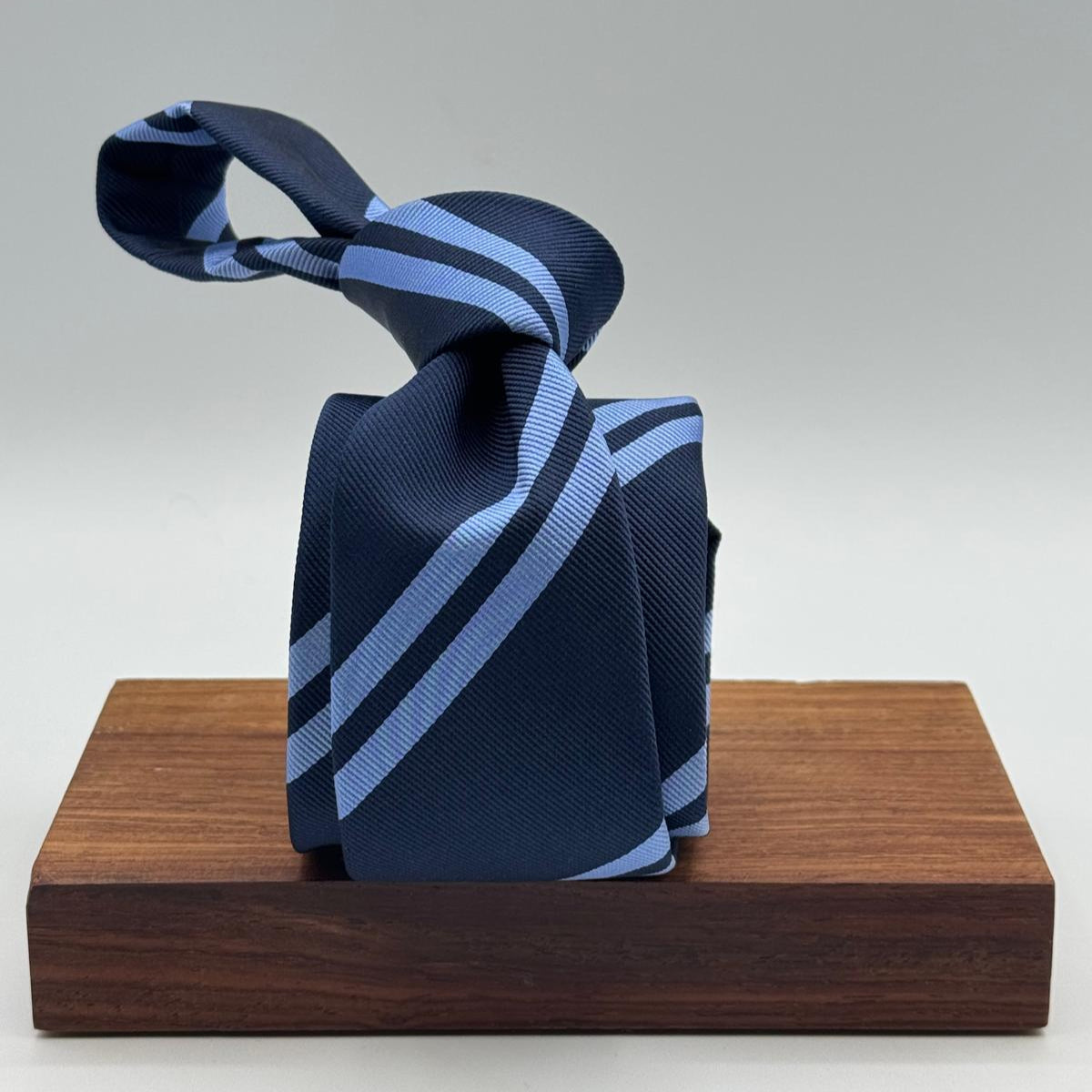 Cruciani &amp; Bella
100% Silk&nbsp;
Unlined
Brown Tie
Blue and Light Blue Stripes Tie
Handmade in Italy
7,5 cm x 148 cm
New Old Stock
