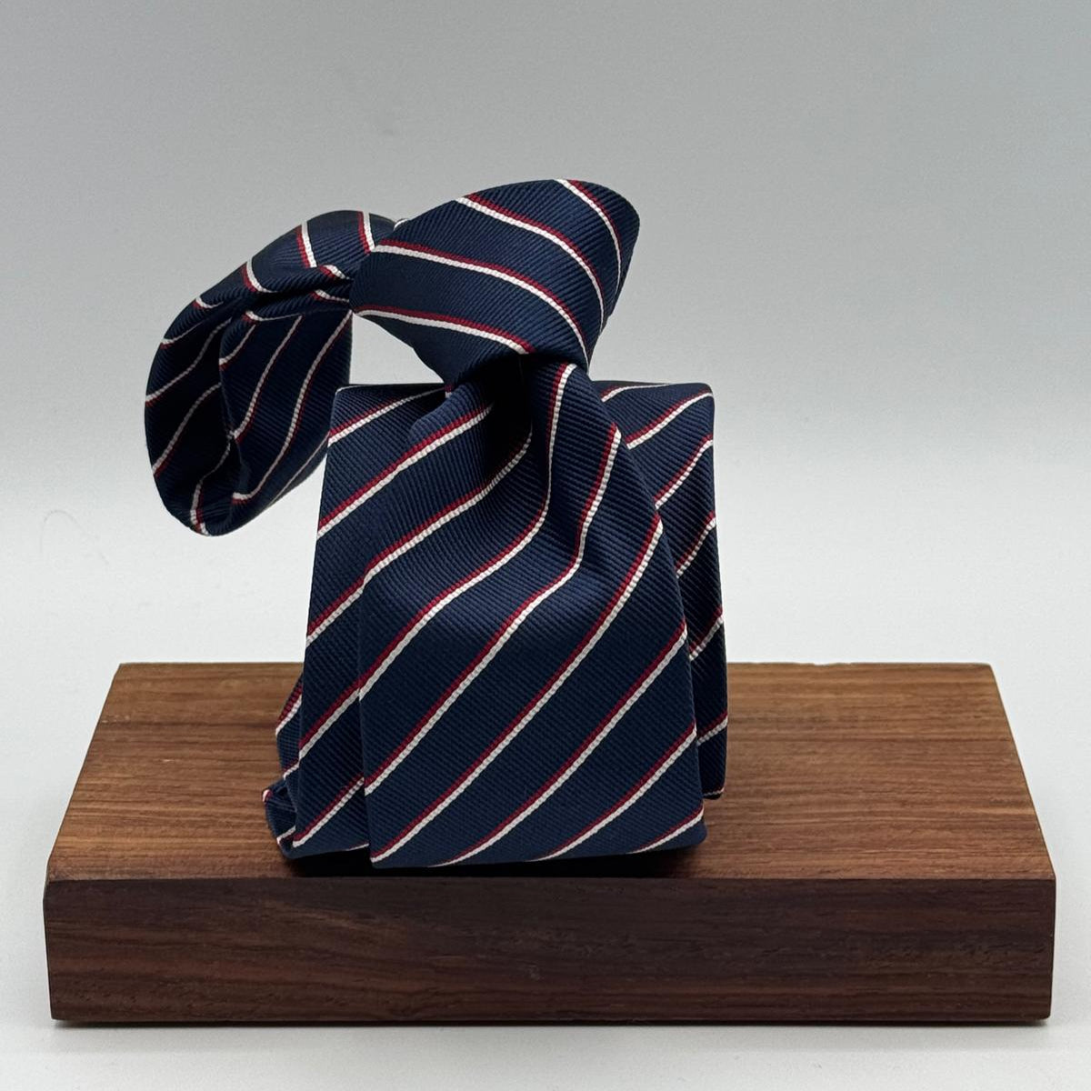 Cruciani &amp; Bella
100% Silk&nbsp;
Unlined
Brown Tie
Blue, Red and White Stripes Tie
Handmade in Italy
7,5 cm x 148 cm
New Old Stock