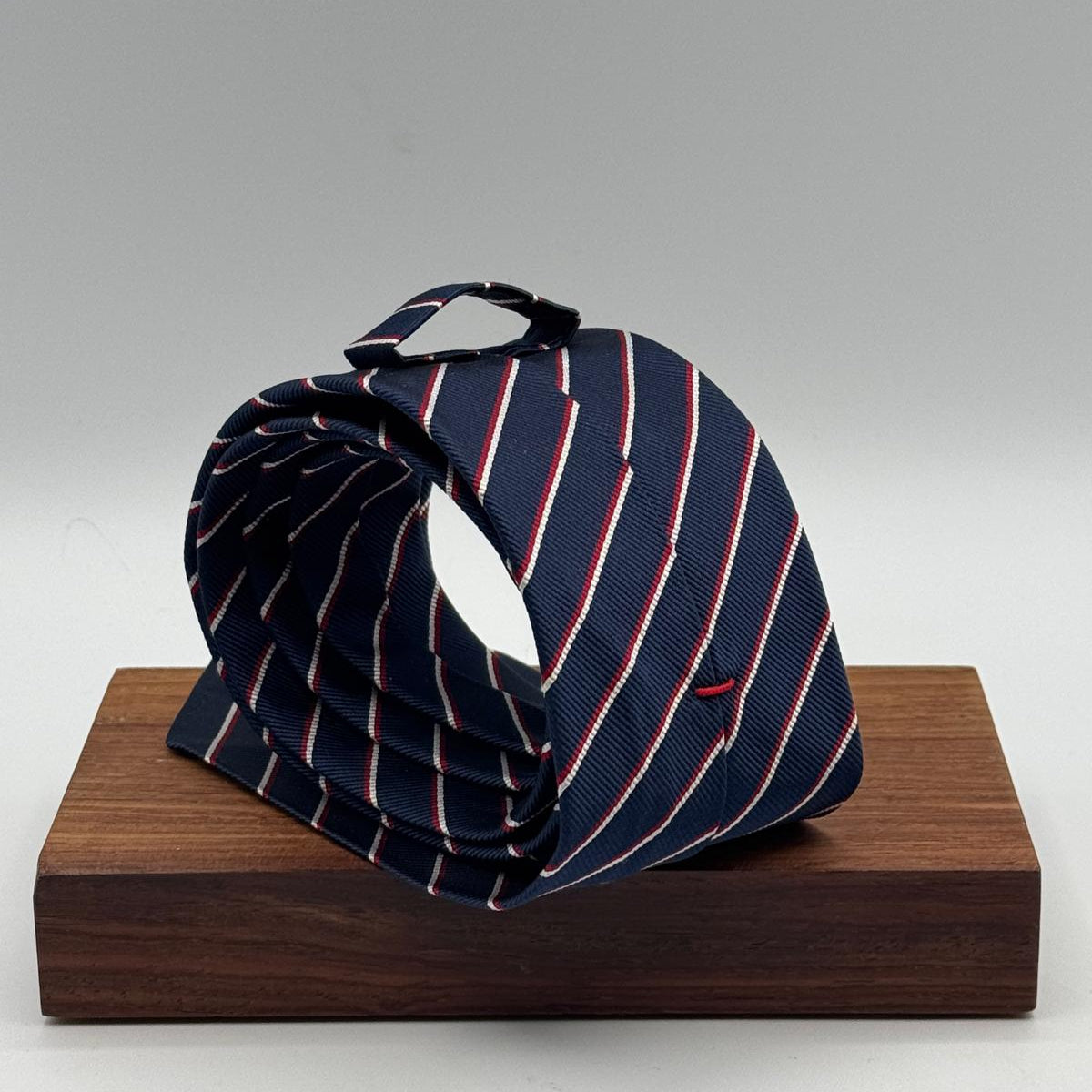 Cruciani &amp; Bella
100% Silk&nbsp;
Unlined
Brown Tie
Blue, Red and White Stripes Tie
Handmade in Italy
7,5 cm x 148 cm
New Old Stock