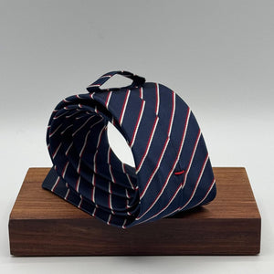Cruciani &amp; Bella
100% Silk&nbsp;
Unlined
Brown Tie
Blue, Red and White Stripes Tie
Handmade in Italy
7,5 cm x 148 cm
New Old Stock