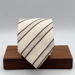 Cruciani &amp; Bella
60% Cotton&nbsp; 40% Linen
Jaquard
Self Tipped Tie
Off White and Light Brown Stripes
Handmade in Italy
9 cm x 148 cm
New Old Stock