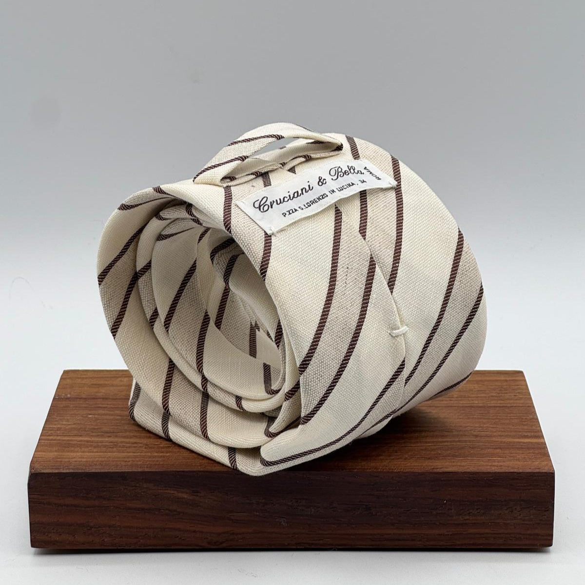 Cruciani &amp; Bella
60% Cotton&nbsp; 40% Linen
Jaquard
Self Tipped Tie
Off White and Light Brown Stripes
Handmade in Italy
9 cm x 148 cm
New Old Stock