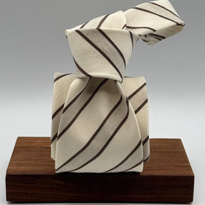 Cruciani &amp; Bella
60% Cotton&nbsp; 40% Linen
Jaquard
Self Tipped Tie
Off White and Light Brown Stripes
Handmade in Italy
9 cm x 148 cm
New Old Stock