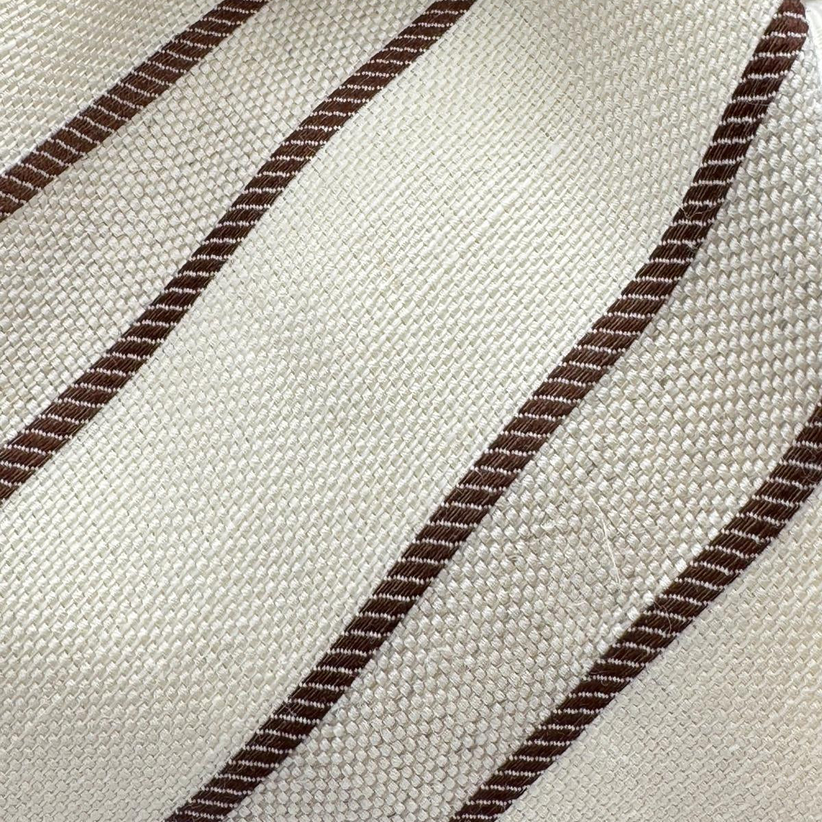 Cruciani &amp; Bella
60% Cotton&nbsp; 40% Linen
Jaquard
Self Tipped Tie
Off White and Light Brown Stripes
Handmade in Italy
9 cm x 148 cm
New Old Stock