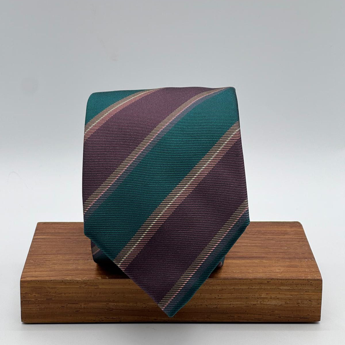 Cruciani &amp; Bella
100% Silk&nbsp;
Woven Jaquard
Self Tipped&nbsp;
Red Wine, Green, Brown and Beige Stripes
Handmade in Italy
9 cm x 148 cm
New Old Stock