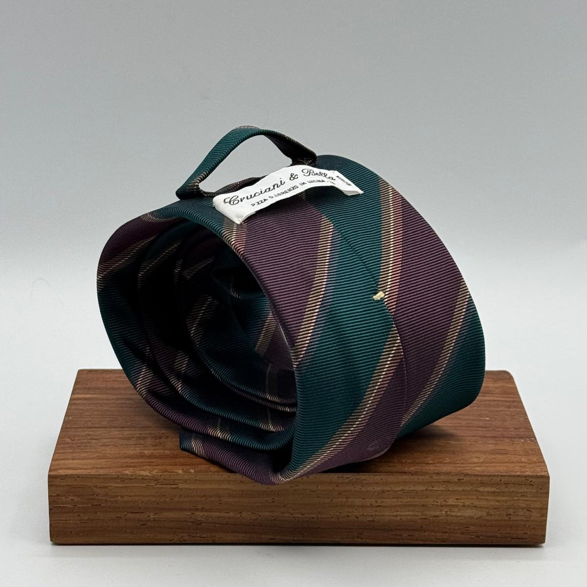 Cruciani &amp; Bella
100% Silk&nbsp;
Woven Jaquard
Self Tipped&nbsp;
Red Wine, Green, Brown and Beige Stripes
Handmade in Italy
9 cm x 148 cm
New Old Stock