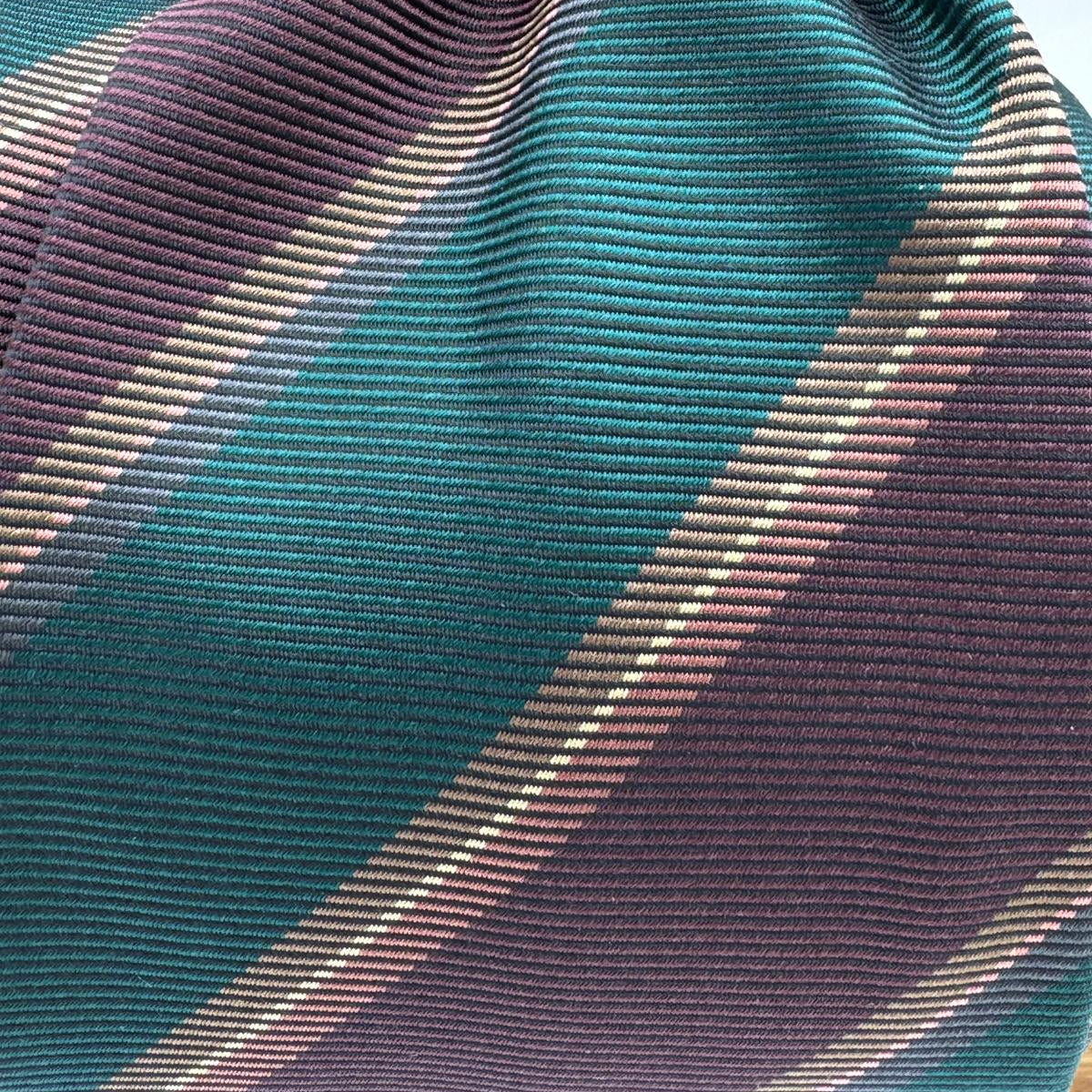 Cruciani &amp; Bella
100% Silk&nbsp;
Woven Jaquard
Self Tipped&nbsp;
Red Wine, Green, Brown and Beige Stripes
Handmade in Italy
9 cm x 148 cm
New Old Stock