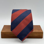 Cruciani &amp; Bella
100% Silk&nbsp;
Woven Jaquard
Self Tipped&nbsp;
Blue and Rust Stripes
Handmade in Italy
9 cm x 148 cm
New Old Stock