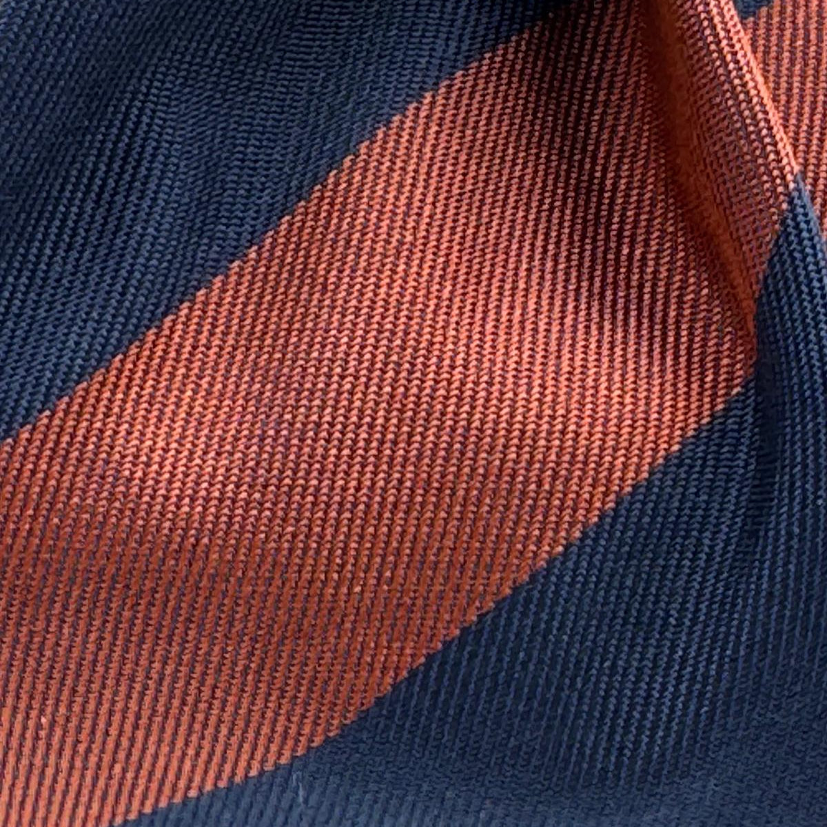 Cruciani &amp; Bella
100% Silk&nbsp;
Woven Jaquard
Self Tipped&nbsp;
Blue and Rust Stripes
Handmade in Italy
9 cm x 148 cm
New Old Stock