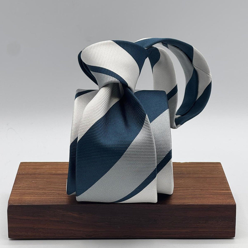 Cruciani &amp; Bella
100% Silk&nbsp;
Woven Jaquard
Self Tipped&nbsp;
Octanium, White and Grey Stripes
Handmade in Italy
8 cm x 148 cm
New Old Stock