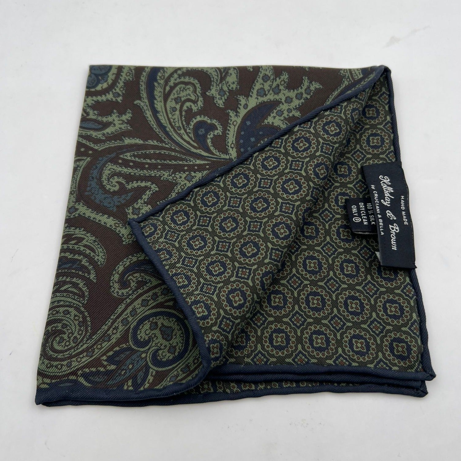 Holliday & Brown Hand-rolled   Holliday & Brown for Cruciani & Bella 100% Silk Green, Brown and Blue Double Faces Patterned  Motif  Pocket Square Handmade in Italy 32 cm X 32 cm #7031